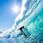 Surfer On Blue Ocean Wave