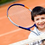 Boy playing tennis